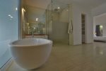 Master bathroom with free standing bath tub and walk in shower. 